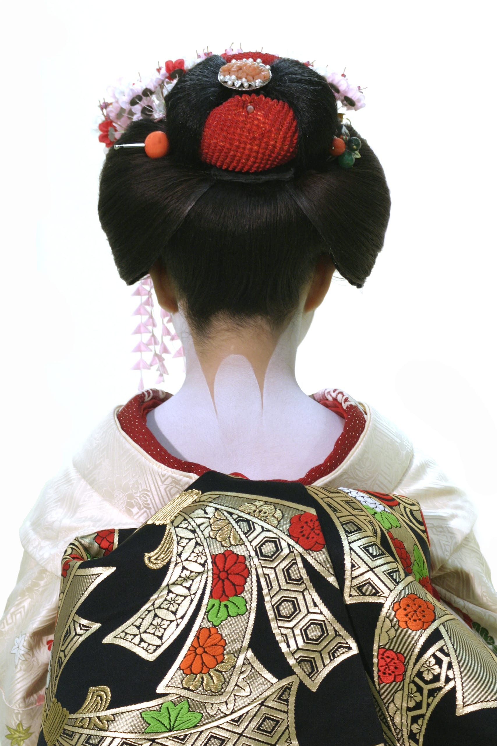 A geiko's kimono and obi seen from behind in a Kamishichiken teahouse
