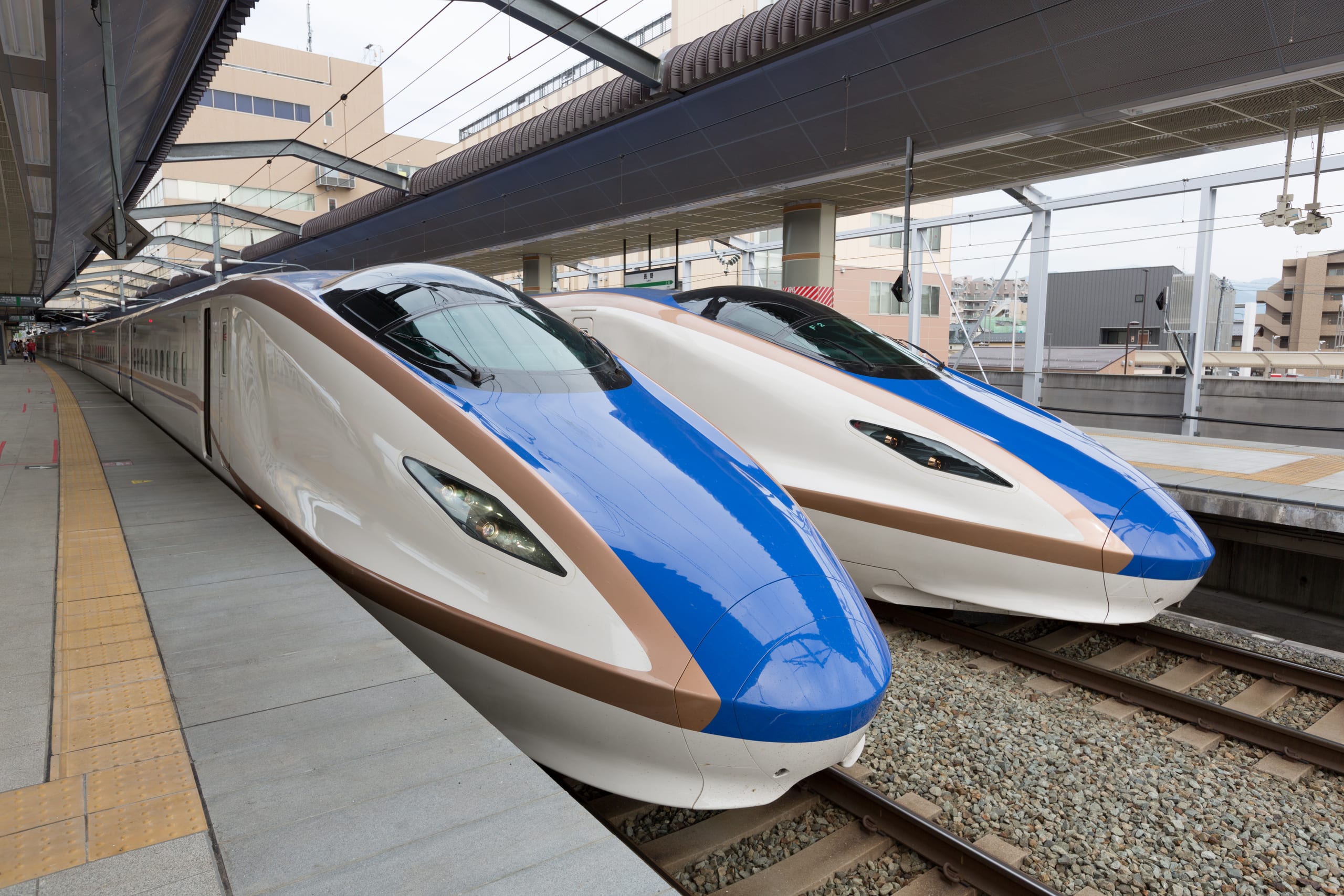 A Shinkansen carriage interior with wide first-class seating