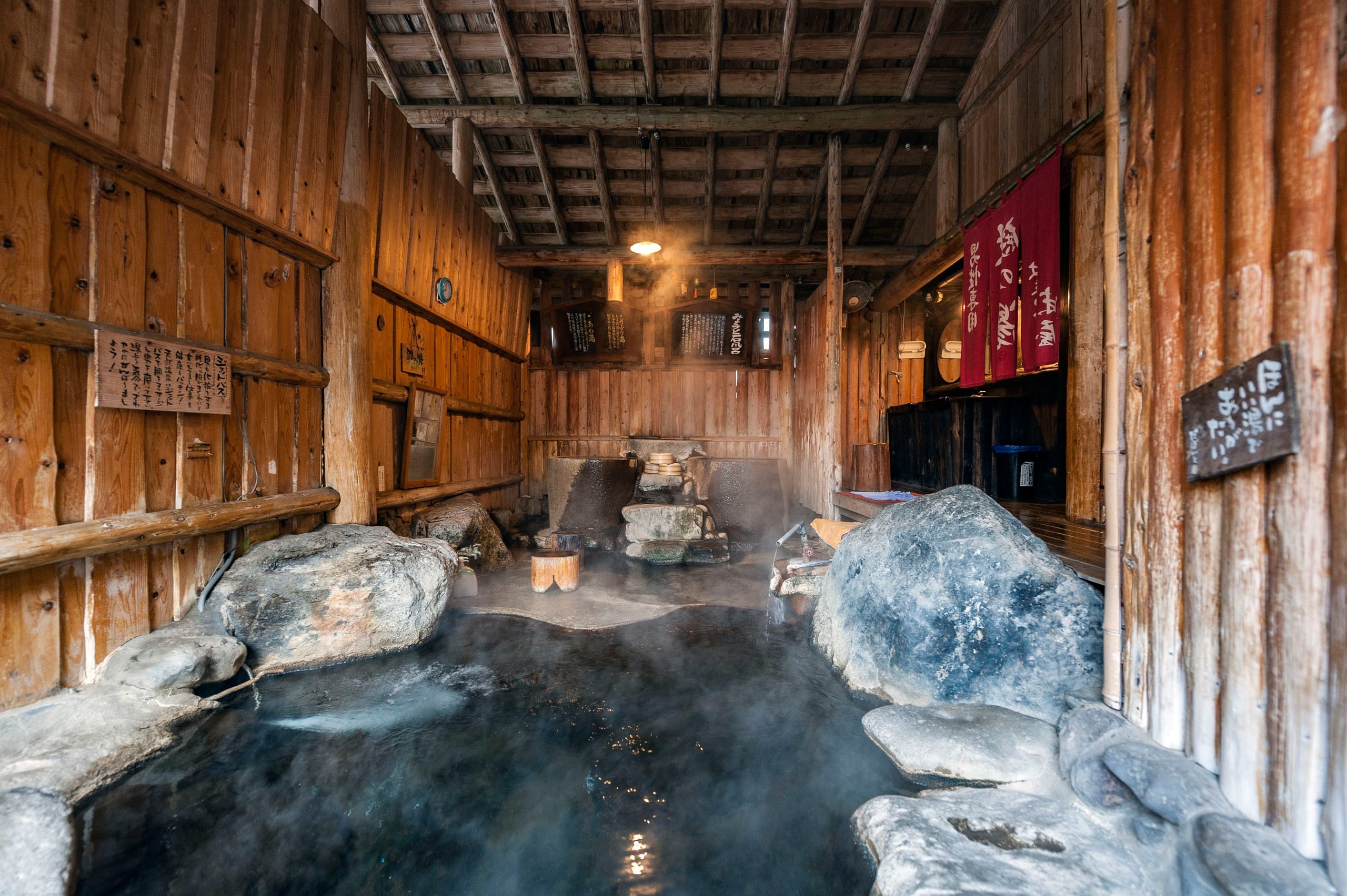 Tsuta Onsen's wooden inn standing in the beech forest