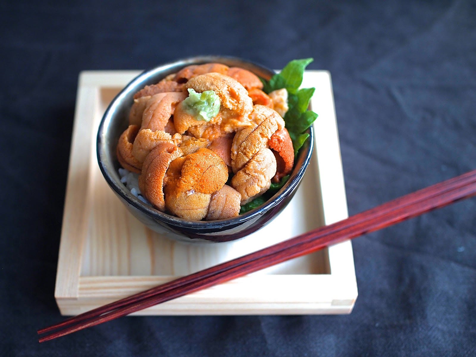 A bowl of sea urchin spooned over rice, Shakotan coast